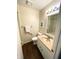 Well-lit bathroom featuring a vanity, toilet, and shower with accessibility features at 5850 Bradston Way, Indianapolis, IN 46237