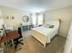 Neutral bedroom with white trimmings, neutral carpet, a desk, and a bed at 5850 Bradston Way, Indianapolis, IN 46237