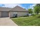 Well-maintained brick home with manicured lawn, showcasing classic architecture and inviting atmosphere at 5850 Bradston Way, Indianapolis, IN 46237