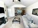 Cozy living room features a fireplace, storage closet and access to kitchen at 5850 Bradston Way, Indianapolis, IN 46237