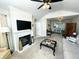Living room showcasing a fireplace and seamless connection to the kitchen at 5850 Bradston Way, Indianapolis, IN 46237