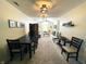 Open-concept living room with dining area, fireplace, and natural light at 5850 Bradston Way, Indianapolis, IN 46237