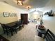Open-concept living room with dining area, fireplace, and comfortable seating at 5850 Bradston Way, Indianapolis, IN 46237