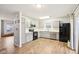 Modern kitchen with gray cabinets, white countertops, and black appliances at 6354 River Run Dr, Indianapolis, IN 46221