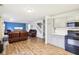 Open kitchen with gray cabinets, white countertops, and black appliances at 6354 River Run Dr, Indianapolis, IN 46221