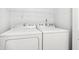 Laundry room with side by side Whirlpool washer and dryer at 6354 River Run Dr, Indianapolis, IN 46221