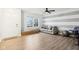 Spacious living room with gray walls, hardwood floors, and a comfy couch at 6354 River Run Dr, Indianapolis, IN 46221