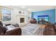 Living room with hardwood floors, fireplace, and leather couches at 6354 River Run Dr, Indianapolis, IN 46221