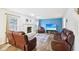 Living room with hardwood floors, fireplace, and leather couches at 6354 River Run Dr, Indianapolis, IN 46221