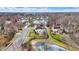 A neighborhood with trees and a partially frozen lake at 6530 Duck Pond Dr, Fishers, IN 46038