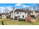 A well-maintained backyard featuring a patio, fire pit, and manicured landscaping at 6530 Duck Pond Dr, Fishers, IN 46038