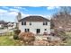 A spacious backyard showcasing a stone patio with fire pit for outdoor entertainment at 6530 Duck Pond Dr, Fishers, IN 46038