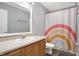 Bathroom featuring a sink, rainbow shower curtain, and neutral flooring at 6530 Duck Pond Dr, Fishers, IN 46038