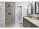 Bathroom featuring a glass shower, double sinks, and granite countertops at 6530 Duck Pond Dr, Fishers, IN 46038
