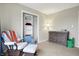 Bedroom with a rocking chair, changing table, and closet storage at 6530 Duck Pond Dr, Fishers, IN 46038