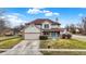 Charming two-story home features a covered porch, attached garage, and well-manicured lawn at 6530 Duck Pond Dr, Fishers, IN 46038