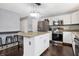 Modern kitchen featuring granite countertops, stainless steel appliances, and an island at 6530 Duck Pond Dr, Fishers, IN 46038