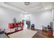 Spacious living room showcases hardwood floors, gray walls, and an adjacent kitchen at 6530 Duck Pond Dr, Fishers, IN 46038