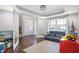 Bright living room features hardwood floors, playroom and french doors leading to the foyer at 6530 Duck Pond Dr, Fishers, IN 46038