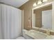 Bathroom with marble countertop and white fixtures at 714 Buchanan St # 5, Indianapolis, IN 46203