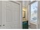 Small bathroom with green vanity and window at 714 Buchanan St # 5, Indianapolis, IN 46203