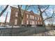 Rear view of a brick building with a black fence at 714 Buchanan St # 5, Indianapolis, IN 46203