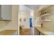 Modern galley kitchen with white subway tile and beige counters at 714 Buchanan St # 5, Indianapolis, IN 46203