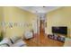 Open concept living area with hardwood floors and dining area at 714 Buchanan St # 5, Indianapolis, IN 46203
