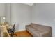 Bright office space with a wooden desk and comfy sofa at 714 Buchanan St # 5, Indianapolis, IN 46203