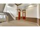 Well-lit building staircase with carpeted steps at 714 Buchanan St # 5, Indianapolis, IN 46203