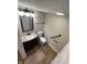 Cozy bathroom featuring a granite-topped vanity, tiled floors, and handrails for accessibility at 7307 Thornmill Ct, Avon, IN 46123