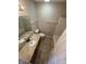Bathroom featuring a granite vanity, tile floors, and a combined tub and shower, perfect for everyday convenience at 7307 Thornmill Ct, Avon, IN 46123