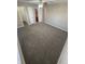 Neutral bedroom offers ceiling fan, closet, and adjoined bathroom with tiled floors at 7307 Thornmill Ct, Avon, IN 46123