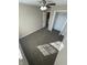 Well lit carpeted bedroom with closet, fan and adjacent bath at 7307 Thornmill Ct, Avon, IN 46123