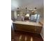 Charming kitchen with wooden cabinets, breakfast bar, white appliances, and bright pendant lighting at 7307 Thornmill Ct, Avon, IN 46123