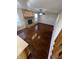 Open-concept living room featuring hardwood floors, brick fireplace, and abundant natural light at 7307 Thornmill Ct, Avon, IN 46123