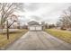 Spacious backyard with a two-car garage and basketball hoop at 8139 Hi Vu Dr, Indianapolis, IN 46227