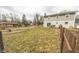 Large backyard with a patio and wooden fence at 8139 Hi Vu Dr, Indianapolis, IN 46227