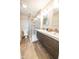 Updated bathroom featuring double vanity and walk-in shower at 8139 Hi Vu Dr, Indianapolis, IN 46227