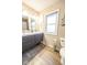 Clean bathroom with double vanity and wood-look tile floors at 8139 Hi Vu Dr, Indianapolis, IN 46227