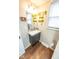 Updated bathroom with floating vanity and mosaic tile at 8139 Hi Vu Dr, Indianapolis, IN 46227