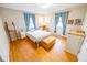 Bright bedroom with hardwood floors and ample natural light at 8139 Hi Vu Dr, Indianapolis, IN 46227