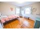 Second bedroom with hardwood floors and plenty of natural light at 8139 Hi Vu Dr, Indianapolis, IN 46227