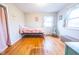 Charming bedroom with hardwood floors and a pink comforter at 8139 Hi Vu Dr, Indianapolis, IN 46227