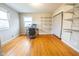 Versatile bedroom with hardwood floors and built-in shelving at 8139 Hi Vu Dr, Indianapolis, IN 46227