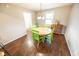 Dining room with round wood table and lime green chairs at 8139 Hi Vu Dr, Indianapolis, IN 46227
