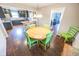 Bright dining room with round table and lime green chairs at 8139 Hi Vu Dr, Indianapolis, IN 46227