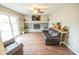 Gathering room with a fireplace, hardwood floors, and sliding doors to patio at 8139 Hi Vu Dr, Indianapolis, IN 46227