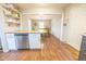 Modern kitchen with island and view into dining area at 8139 Hi Vu Dr, Indianapolis, IN 46227