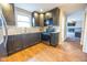 Modern kitchen with dark cabinets and stainless steel appliances at 8139 Hi Vu Dr, Indianapolis, IN 46227